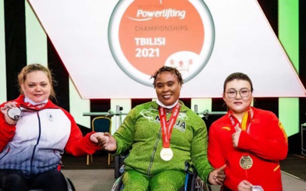 Nigerian powerlifting champion Bose Omolayo (centre) claimed the victory at the World Para Powerlifting Championship in style, breaking the world record in the women’s 79 kilograms category in the Georgian capital, Tbilisi. With Omolayo is Russia’s Vera Muratova (left) who won silver, and China’s defending champion, Han Miaoyu, who finished with bronze. Photo: Supplied