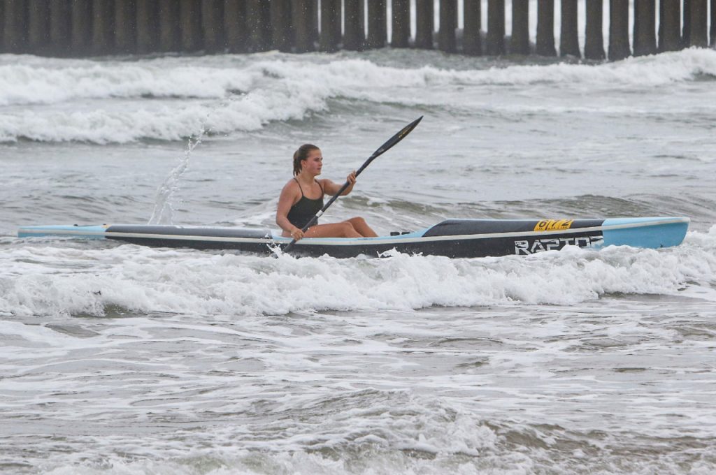 Using the skills that took her to a second junior surfski title Saskia Hockly powered away on the ski leg of the 2022 Ocean Heroes at Dairy Beach on Sunday. Photo: Brian Spurr/Gameplan Media