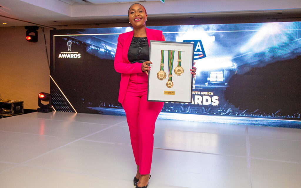 SPAR National PR, Communications and Sponsorship Manager, Mpudi Maubane receives a Special Recognition Award to SPAR from Athletics South Africa at the ASA 2023 Awards dinner. Photo: Tumelo Mabua / Tshwantsho Media