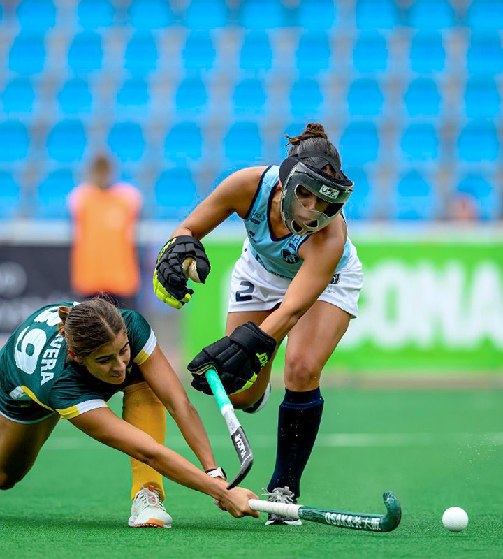 Danielia de Oliveira shoots as Uruguay successfully defends one of South Africa’s four penalty corners during the matc