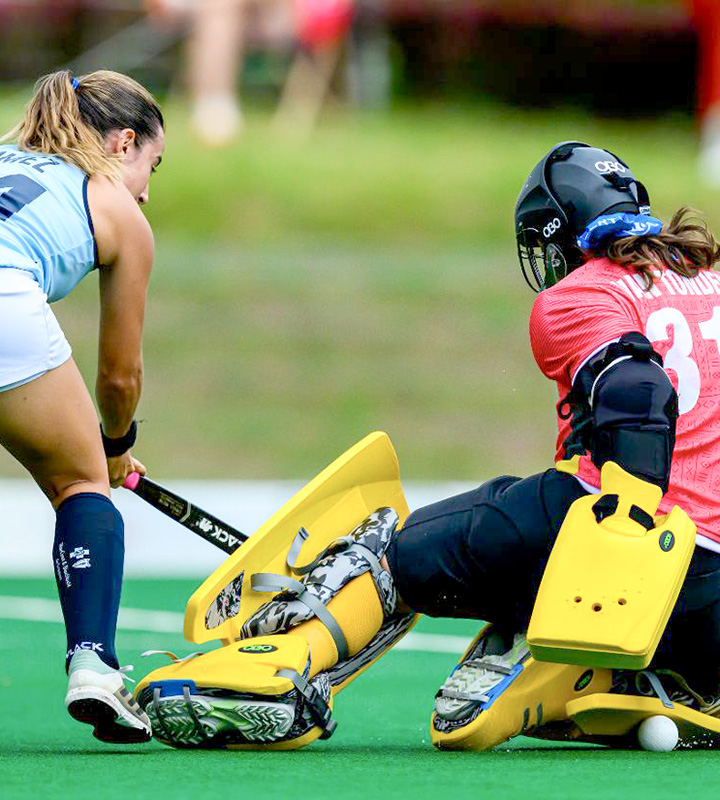 Magdalena Gomez’s reverse-stick shot for Uruguay defended by South Africa goal keeper Marlise van Tonder.