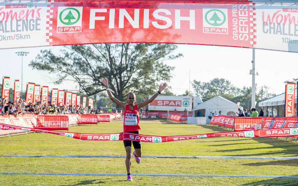 Glenrose Xaba raises her arms in victory as she crosses the line in 31.54 for her career-first Durban Spar Grand Prix 10km title, at Kings Park Stadium in Durban, KwaZulu-Natal on Sunday 22 June 2025. All Photos: Darren Stewart / Gallo Images