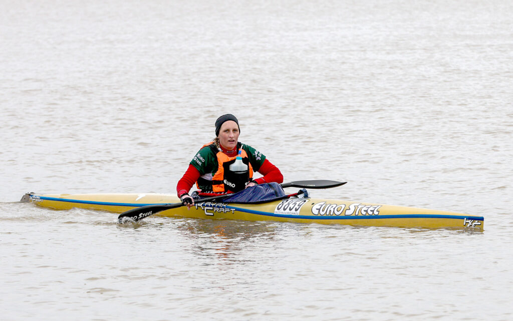 An exhausted Jenna Nisbet crosses the line to win her third Berg River Canoe Marathon title, at Velddrif on the Western Cape’s Atlantic seaboard, on Saturday, 5 July 2025. All Photos: John Hishin / Gameplan Media
