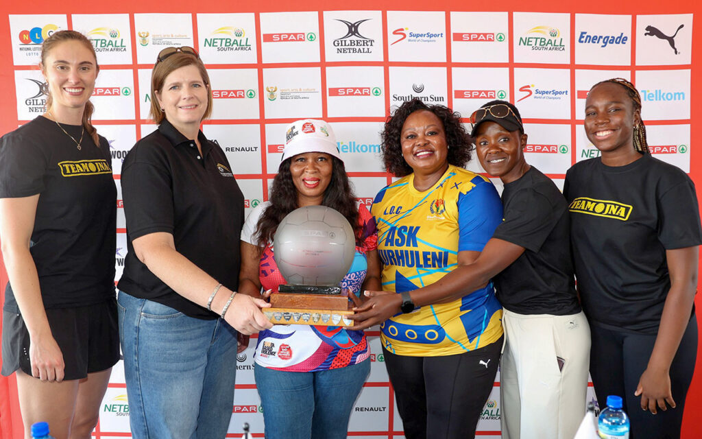 The 2025 Spar National Netball Championships defending champions, Johannesburg represented by (from left) senior captain Tinita van Dyk and coach Dr. Elsje Jordaan, joined by Netball South Africa President, Mami Diale, Ekurhuleni Netball Association President, Motlalepule Mmati, and defending U21 champs coach Bongi Msomi, and skipper, Phila Ntuli. The tournament will be underway at Dr EG Jansen Hoerskool in Boksburg, Ekurhuleni, at 7:30am on Monday, 1 December 2025. All Photos: Reg Caldecott