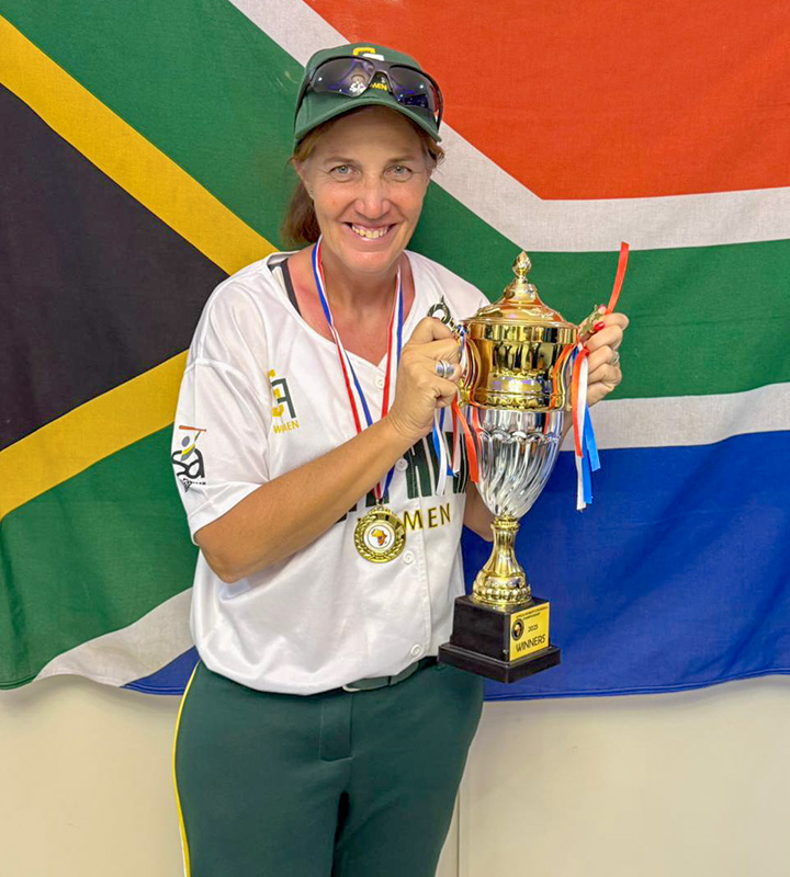 SA Women’s National Baseball Team Coach Hayley Scott-Maree proudly presents South Africa’s Africa Champions trophy.