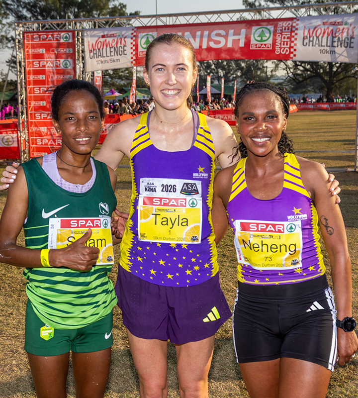 The top three smile together, runner-up Selam Gebre, race winner Tayla Kavanagh and third-placed Neheng Khatala completing the trio.