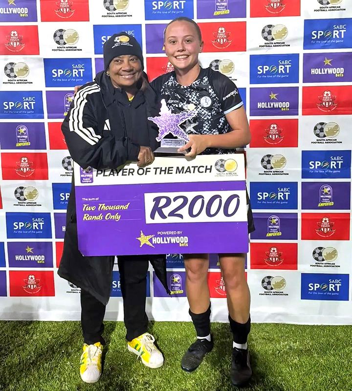 Julia Goncalves, twice on target in JVW FC's 6-1 win, receives her Player of the Match honours from Dr Desiree Ellis.