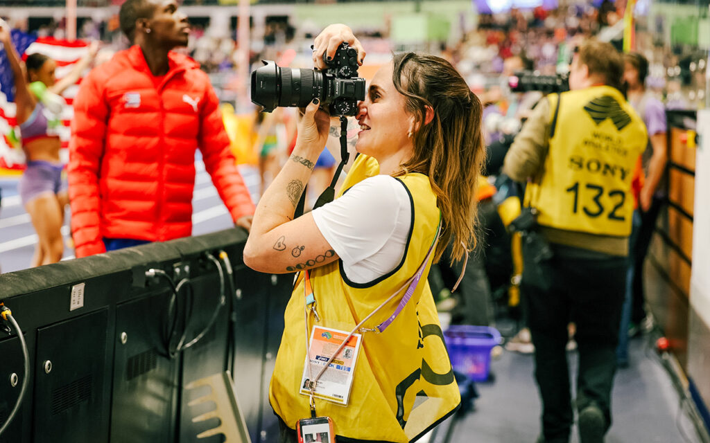 Erin Groll, the Cape Town sports photographer, videographer and digital content creator carrying South African storytelling onto the international athletics circuit, at work with her camera at an athletics meet. All Photos: Supplied