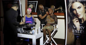 Ravele and gsport Awards Ambassador Liezel van der Westhuizen are prepared for the morning's festivities at the Estee Lauder makeup station, before the Awards event. Photo: Reg Caldecott / gsport4girls
