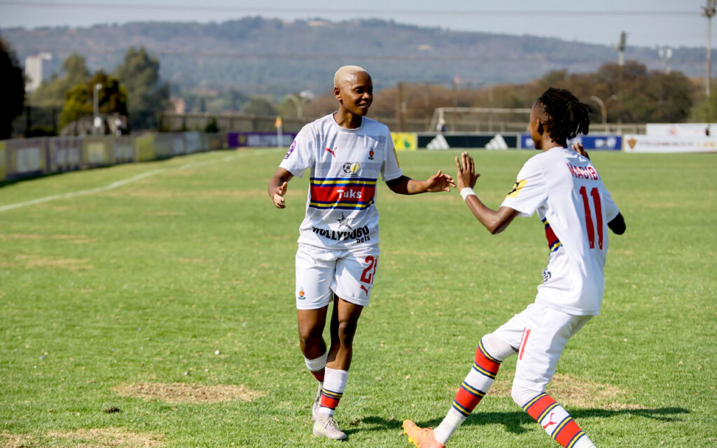 Thembelihle Masibi rushes in to congratulate Siyamthanda Qashani, who struck three times either side of half-time as University of Pretoria swept Stellenbosch FC aside 4-0, taking her league-leading tally to seven goals and lifting Tuks to second in the Hollywoodbets Super League Super Era stream ahead of a top-of-the-table meeting with Mamelodi Sundowns Ladies, at the TUT Main Campus in Pretoria on Saturday, 12 September 2026. Photo: AmaTuks