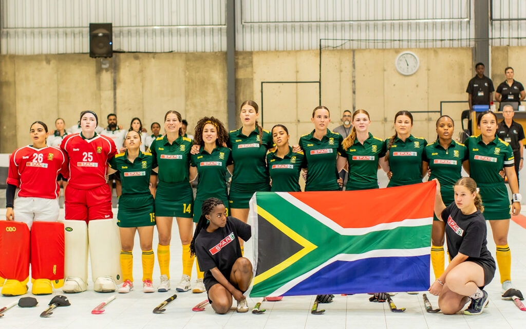 The Spar South African women's indoor hockey team sings the national anthem before the opening Test against Namibia, in which Jehan Abrahams, Anja Tromp, Jodie Blows and goalkeeper Manisha Desai made their international indoor debuts, at the Sports Facilitation Centre at the Windhoek Showgrounds in Windhoek, Namibia on Friday, 9 October 2026. All Photos: Namibia Hockey