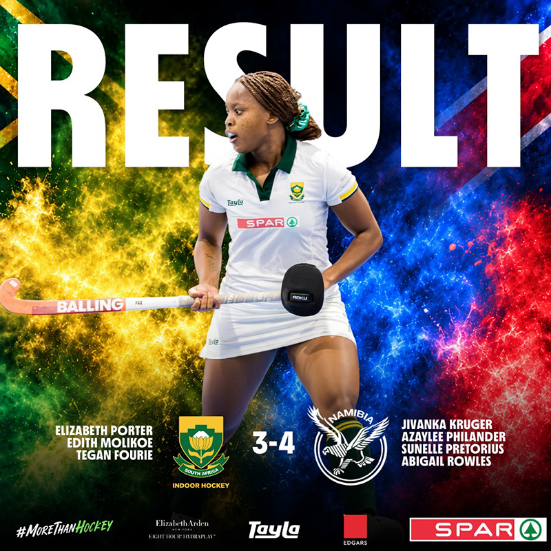 Result graphic for the second Test between South Africa and Namibia in the women's indoor hockey Test series, which Namibia won 4-3. A South African player in a white playing kit with a green collar, her braided hair tied back with a green scrunchie, holds her stick across her body and looks over her shoulder. The word RESULT runs across the top in large white letters behind her. The background splits from green and gold smoke on the left, in the colours of the South African flag, to blue and red smoke on the right, in the colours of the Namibian flag. The South African indoor hockey crest and the Namibia hockey crest sit either side of the score, 3-4. The South African scorers, Elizabeth Porter, Edith Molikoe and Tegan Fourie, are listed on the left, and the Namibian scorers, Jivanka Kruger, Azaylee Philander, Sunelle Pretorius and Abigail Rowles, on the right. A row of sponsor logos runs along the footer.