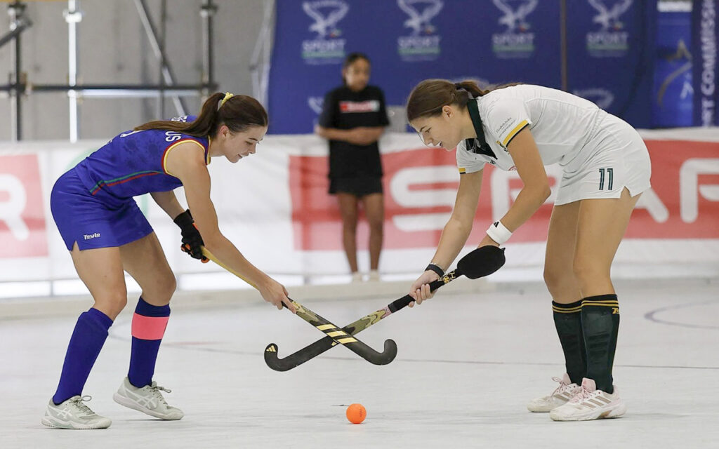 Namibia captain Sunelle Pretorius (left) and South Africa's Cerian Fourie contest a bully restart as the hosts and the Spar South African women's indoor hockey team shared the five-Test series two wins apiece after an eight-goal 4-4 draw, at the Sports Facilitation Centre at the Windhoek Showgrounds in Windhoek, Namibia on Sunday, 11 October 2026. All Photos: Namibia Hockey
