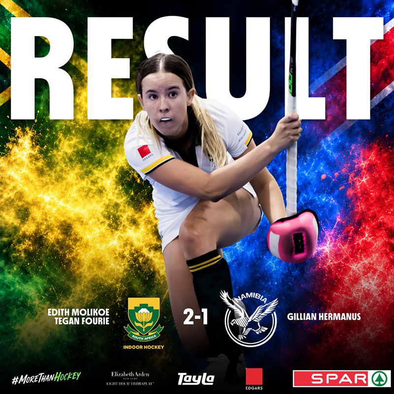 Result graphic for the fourth Test between Namibia and South Africa in the women's indoor hockey Test series, which South Africa won 2-1. A South African player in a white playing kit with gold trim, her blonde hair in a ponytail, lunges low with her stick raised in her right hand and a pink glove on her left. The word RESULT runs across the top in large white letters behind her. The background splits from green and gold smoke on the left, in the colours of the South African flag, to blue and red smoke on the right, in the colours of the Namibian flag. The South African indoor hockey crest and the Namibia hockey crest sit either side of the score, 2-1. The South African scorers, Edith Molikoe and Tegan Fourie, are listed on the left, and the Namibian scorer, Gillian Hermanus, on the right. A row of sponsor logos runs along the footer.