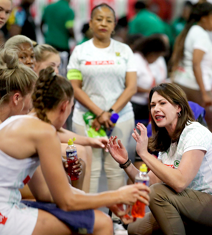 Kneeling among her players during a break in play, Van Dyk guides an athlete-driven Spar Proteas side to make its own decisions.